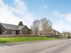 a house on the side of a road at 3 Bed in Penrith oc-86724 in Hackthorpe