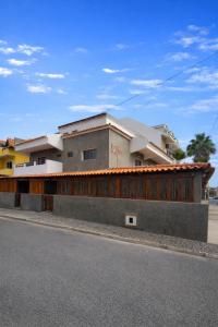 a building on the side of a street at Djeu Guest House in Santa Maria