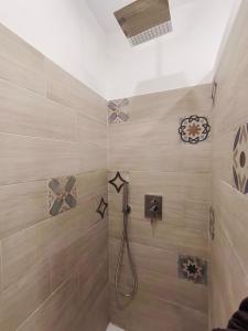 a bathroom with a shower with stars on the wall at casa Giuseppe in Catania +26 photos