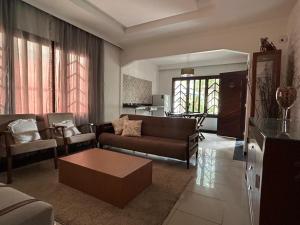a living room with a couch and a table at Casa Gabo in Serra