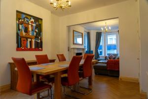 a dining room with a table and chairs at The Red Door in Bangor