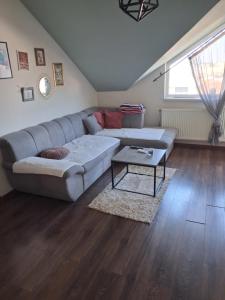 a living room with a couch and a table at Stan na dan Mara in Bijeljina