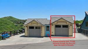 a house with two garage doors on a sidewalk at Summit Home Multi-level with PC Views Ski Trail in Park City
