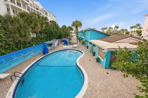 a swimming pool at a resort with a resort at Sand Dune Shores in Palm Beach Shores