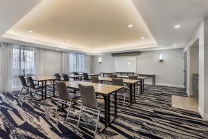 a conference room with tables and chairs and a podium at Best Western Plus Elgin - Chicago in West Dundee +98 photos