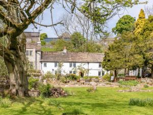 a house with a garden in front of it at 4 Bed in Buxton oc-57687 in Millers Dale