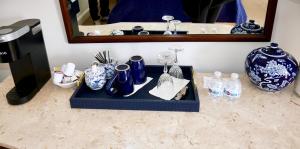 a counter with blue and white vases and a mirror at Turkey Hill Inn in Summit +28 photos