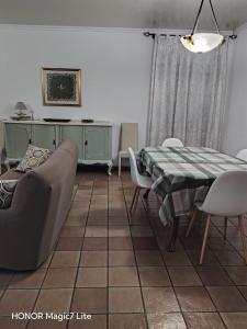 a living room with a table and a couch at La Dimora Dei Cimini in Caprarola