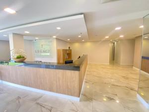 a lobby of a hotel with a reception desk at Legacy Hotel Guaratinguetá - Ao lado de Aparecida -SP in Guaratinguetá +14 photos