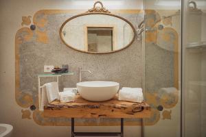 a bathroom with a bowl sink and a mirror at Cinqueteste Luxury Home in Venice +89 photos