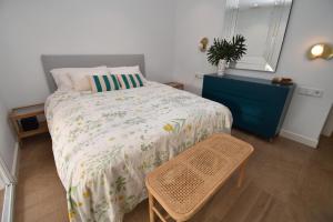 a bedroom with a bed and a blue dresser at Barocco Villa private pool in Santa Pola +26 photos