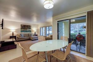 a living room with a table and chairs at Clipper Court 814 in Hilton Head Island