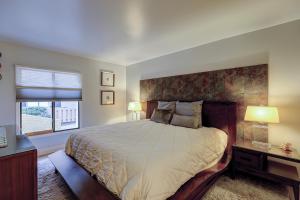 a bedroom with a large bed and a window at Clipper Court 814 in Hilton Head Island