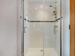 a shower with a glass door in a bathroom at 3 Bed in Swanage oc-94067 in Swanage +12 photos