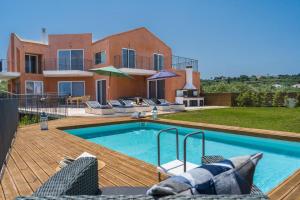 a villa with a swimming pool in front of a house at Astarte Villas - Casa De Sun Private Villa with Pool in Zakynthos