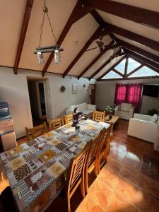 a dining room with a large table and chairs at Hostal JV CASA AMPLIA in Nogales