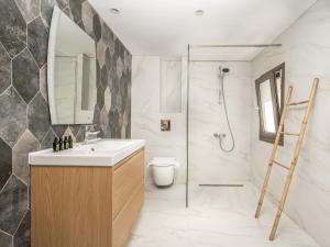 a bathroom with a sink and a shower and a toilet at Astarte Villas - Casa De Sun Private Villa with Pool in Zakynthos +40 photos
