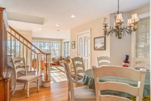 a dining room with chairs and a dining table at Town & Tide Home for 8 in Kennebunkport