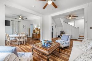 a living room with a couch and a table at Broadway Cottage - Town, Hot Tub, Fire Pit, Grill, Wifi, Family Friendly, Pet Friendly in Berkeley Springs