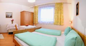 Postel nebo postele na pokoji v ubytování Haus Mitterrutzner