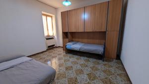 a bedroom with a bed and a cabinet and a window at La Mola B&B in Vignanello +3 photos