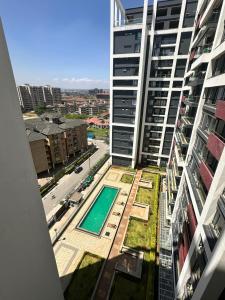 a view from the balcony of a building with a swimming pool at BlaQ Homes in Kanga