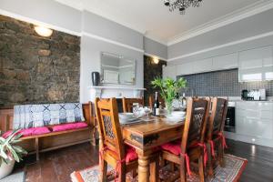 a dining room with a wooden table and chairs at 2 Bed in Langland oc-hh142 in Newton