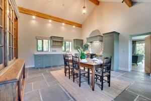 a large kitchen with a wooden table and chairs at 2 Bed in Builth Wells oc-bow198 in Builth Wells +8 photos