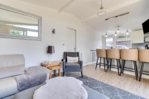 a living room with a couch and a table at 2 Bed in Caswell Bay oc-hh379 in Newton +12 photos