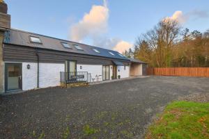 a house with a driveway in front of it at 3 Bed in Machynlleth oc-bow91 in Penegoes