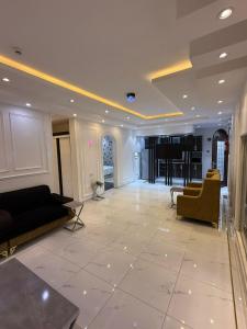 a large living room with couches and a piano at مؤسسة مطلة الورد Matallat Alward Est in Taif +67 photos