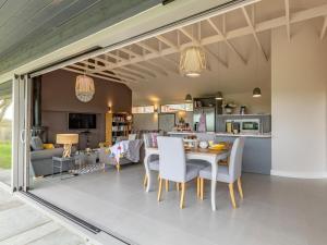 a living room and kitchen with a table and chairs at 2 Bed in Diss oc-51468 in Wortham