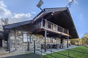 a building with a balcony on the side of it at 4 Bed in Builth Wells oc-bow197 in Builth Wells