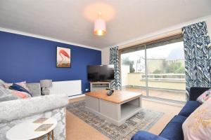 a living room with a couch and a tv at 4 Bed in Seaton oc-s27403 in Seaton