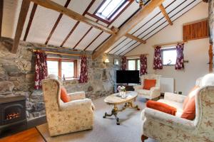 a living room filled with furniture and a fireplace at 2 Bed in Caernarfon oc-wag263 in Llandegfan