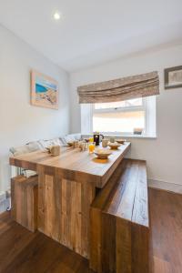 a kitchen with a wooden table with food on it at 3 Bed in Docking oc-1837 in Docking