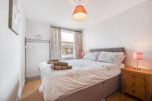 a bedroom with a large bed and a window at 3 Bed in Docking oc-1837 in Docking