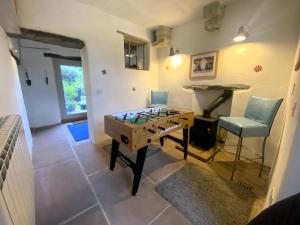 a room with a foosball table and a chair at 2 Bed in Cockermouth oc-86023 in Lorton +13 photos