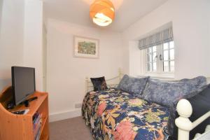 a living room with a couch and a tv at 2 Bed in Seaton oc-b27402 in Seaton +16 photos