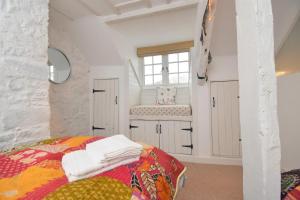 a bedroom with a bed and a window at 2 Bed in Seaton oc-b27402 in Seaton