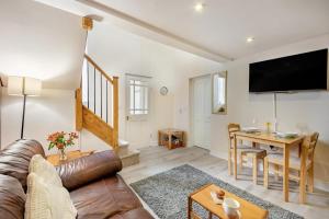 a living room with a couch and a table at 1 Bed in Berwick-upon-Tweed oc-a32026 in Kyloe