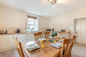 a kitchen with a wooden dining table and chairs at 2 Bed in Berwick-upon-Tweed oc-l32027 in Kyloe