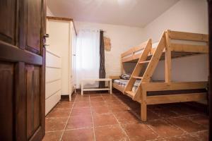 a room with two bunk beds and a tiled floor at Apartments Villa Kras Krk in Malinska