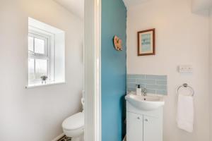 a bathroom with a toilet and a sink at 2 Bed in Berwick-upon-Tweed oc-l32027 in Kyloe +21 photos
