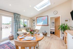 a living room with a table and a couch at 1 Bed in Ashton oc-p30484 in Ashton