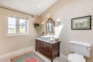 a bathroom with a sink and a toilet and a mirror at 1 Bed in Ashton oc-p30484 in Ashton +18 photos