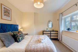 a bedroom with a bed with a stuffed animal on it at 3 Bed in Southwell oc-s30603 in Southwell