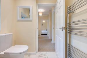 a white bathroom with a toilet and a hallway at 3 Bed in Southwell oc-s30603 in Southwell +31 photos