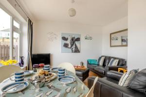 a living room with a table and a couch at 2 Bed in Brixham oc-f28884 in Brixham +9 photos