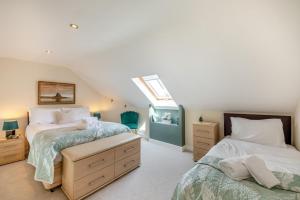 a attic bedroom with two beds and a skylight at 1 Bed in Berwick-upon-Tweed oc-c32028 in Kyloe